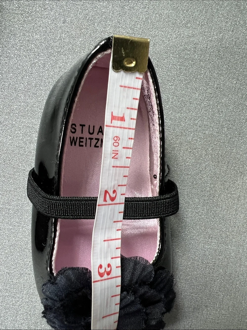 Stuart Weitzman Black Patent Mary Jane Shoes with Flower Accent